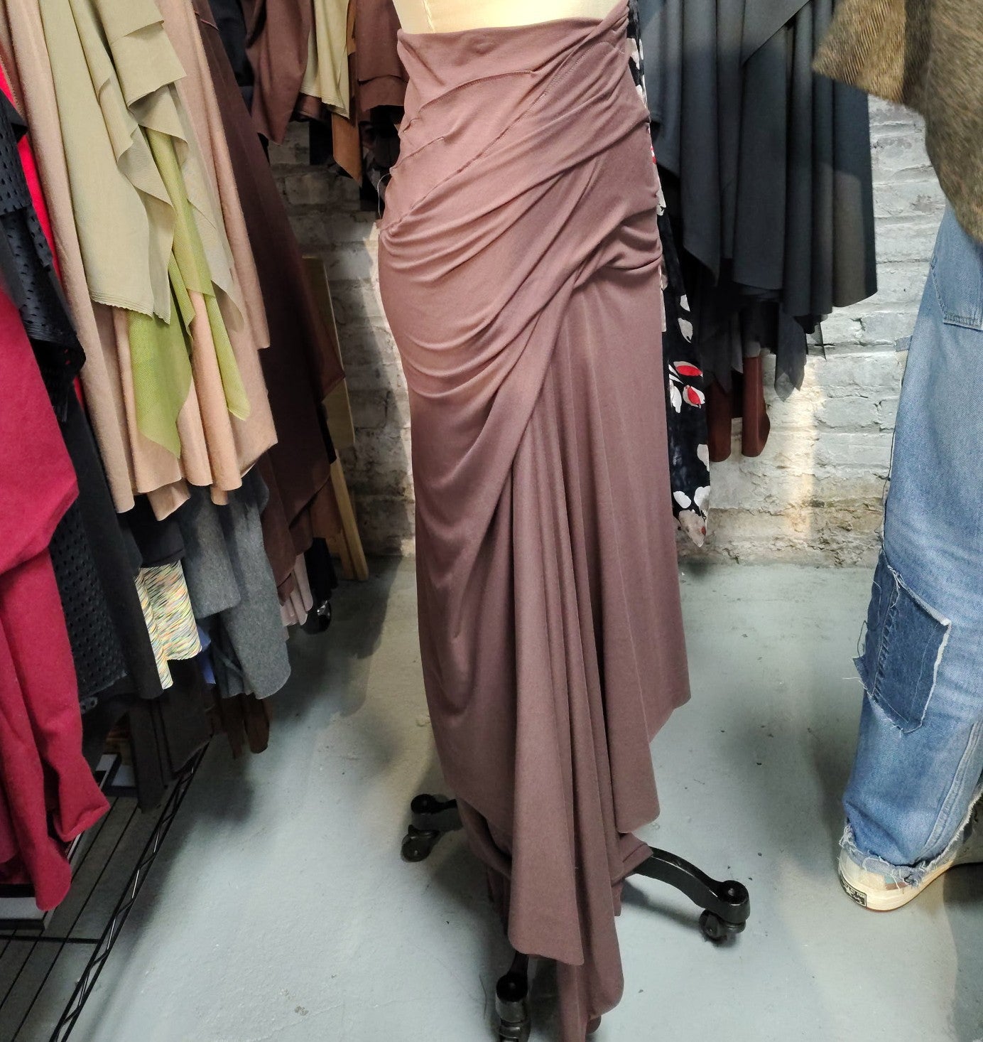 Smooth grace Taupe rayon Lycra with lots of detail draping. Size 6-8