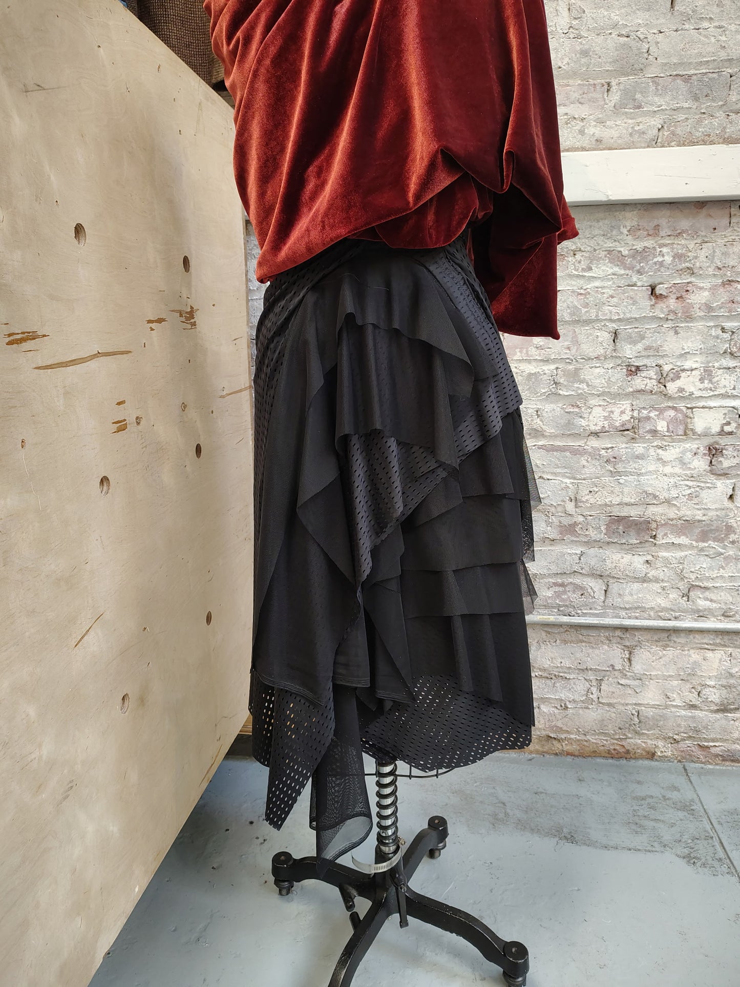 Agility size 8, $155 Black Athletic stretch fabric skirt ready for movement. Has ruching, stitch details and flowy mesh. Designed and made by Cheryl Johnston