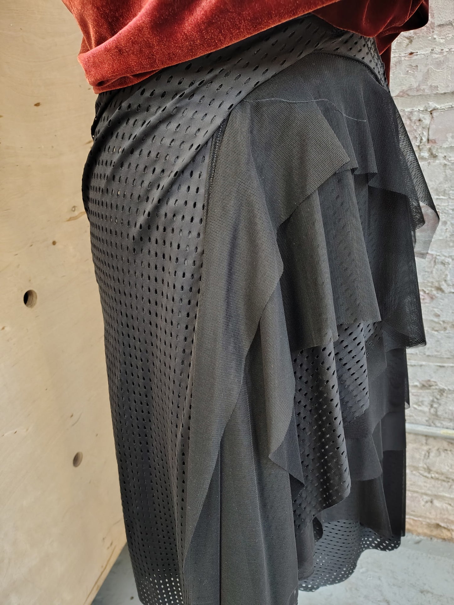 Agility size 8, $155 Black Athletic stretch fabric skirt ready for movement. Has ruching, stitch details and flowy mesh. Designed and made by Cheryl Johnston