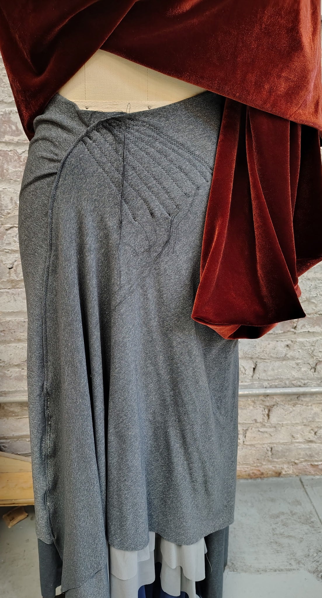 Unravel Me $135 Skirt has stitch detail with some threads hanging loosely. Size 8. Side detail and mesh