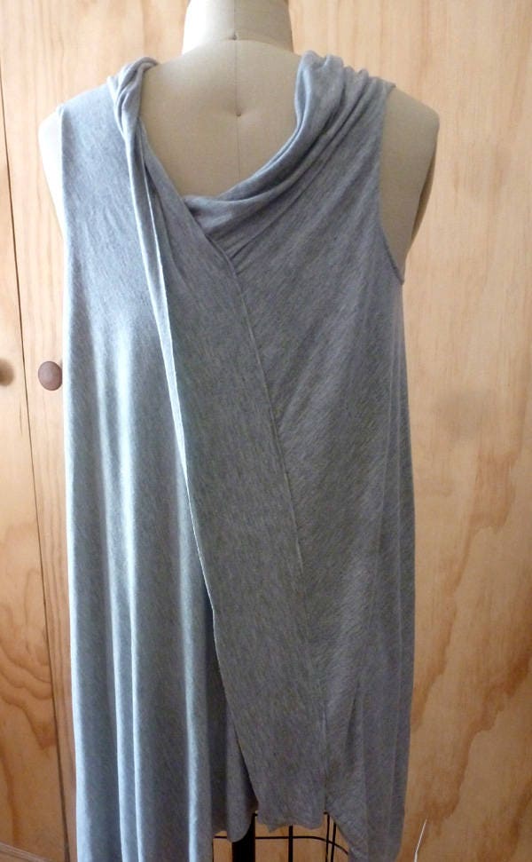 Light gray sleeveless top with front stitch detail and drape back detail