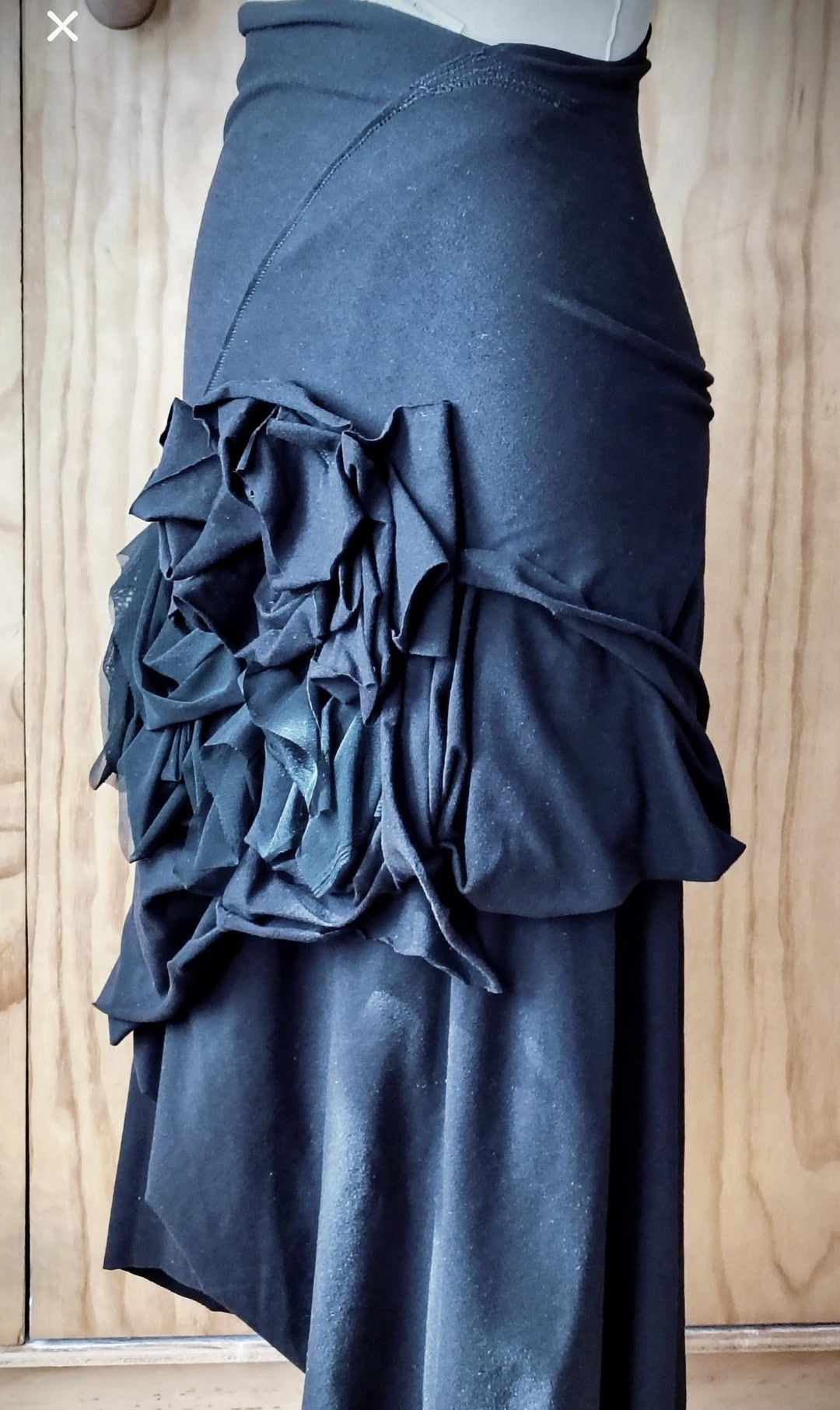 Black layered high waisted skirt in rayon Lycra with random stitch details. By Cheryl Johnston for Johnston Designs.