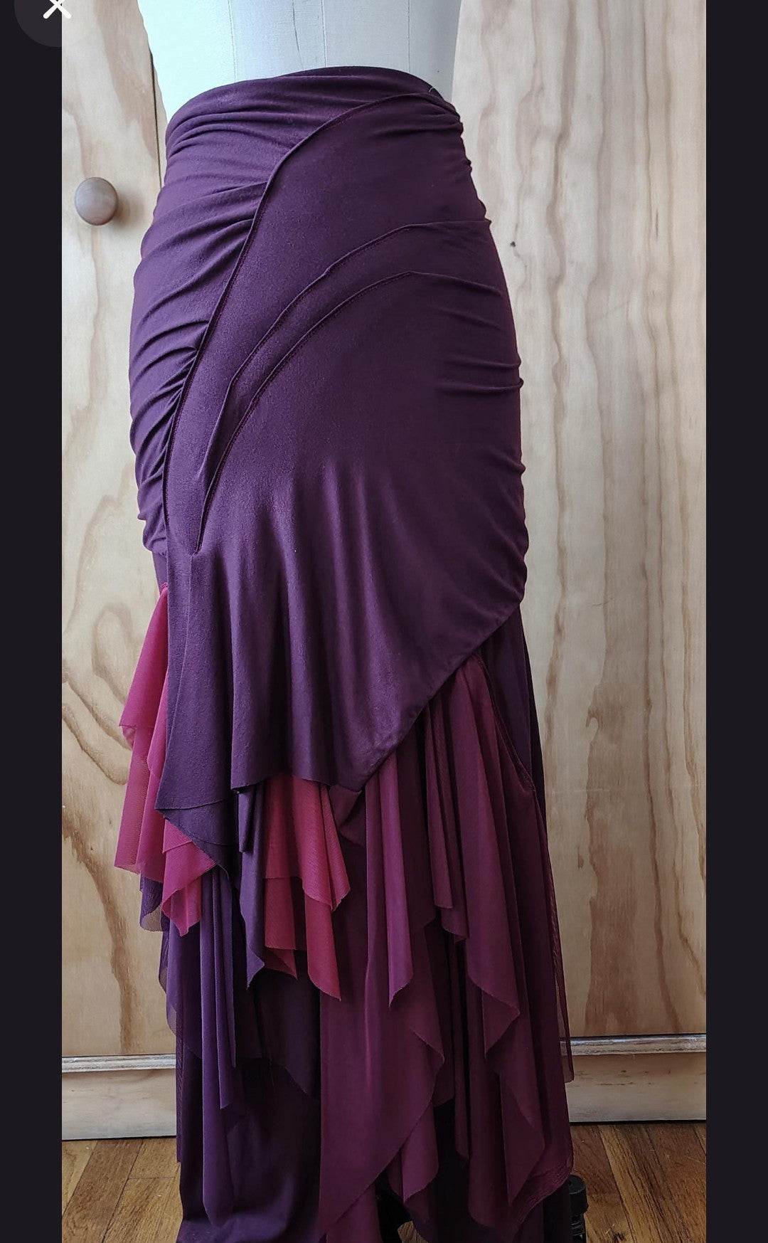 Long plum draped high waisted skirt in rayon Lycra with layers of mesh. Made by Cheryl Johnston for Johnston Designs.