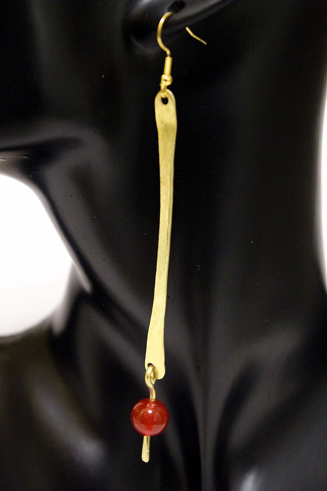 Krakra- Brass long pin with red bead. Artist Wendel Johnston
