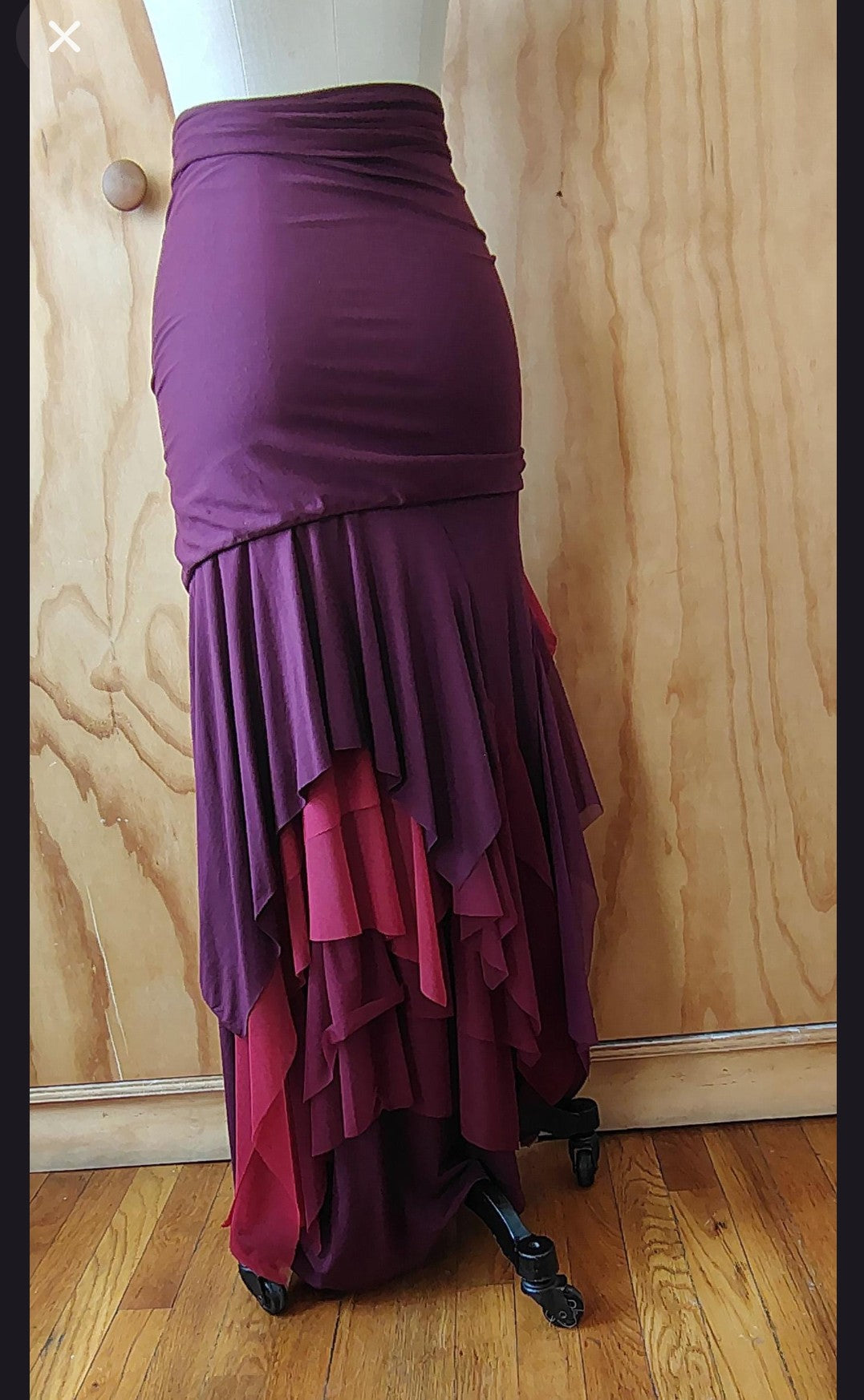 Long plum draped high waisted skirt in rayon Lycra with layers of mesh. Made by Cheryl Johnston for Johnston Designs.