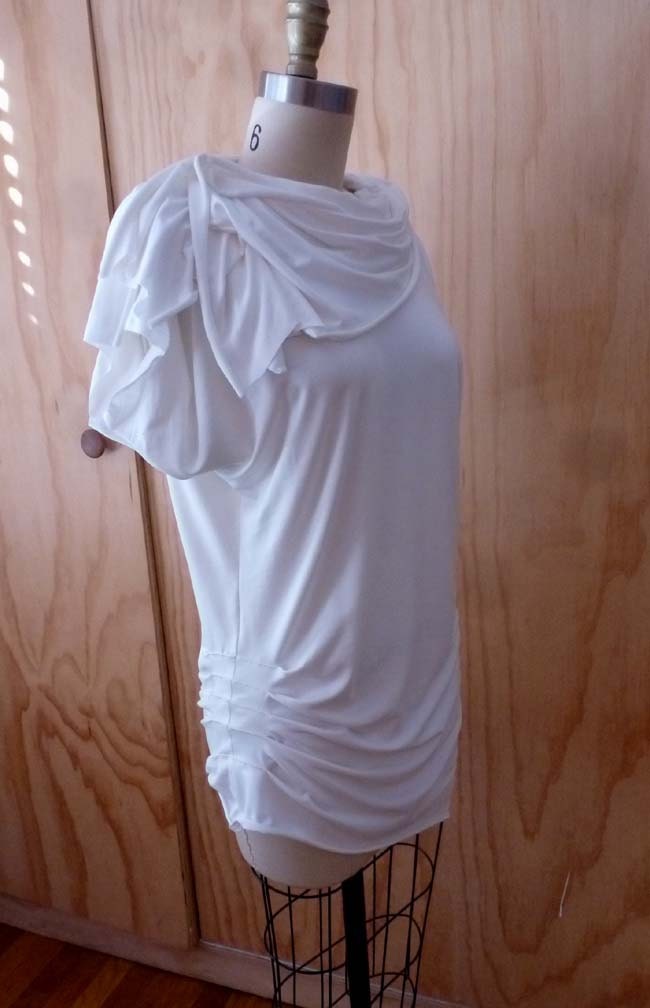 White jersey tunic blouse with cowl neck/detailing at sleeve and one side of bottom