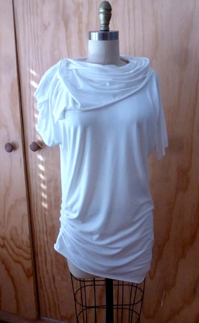 White jersey tunic blouse with cowl neck/detailing at sleeve and one side of bottom