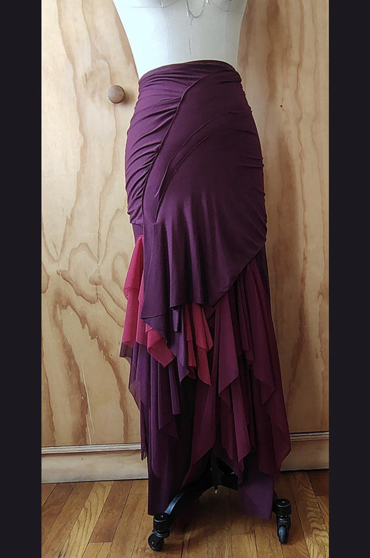 Long plum draped high waisted skirt in rayon Lycra with layers of mesh. Made by Cheryl Johnston for Johnston Designs.